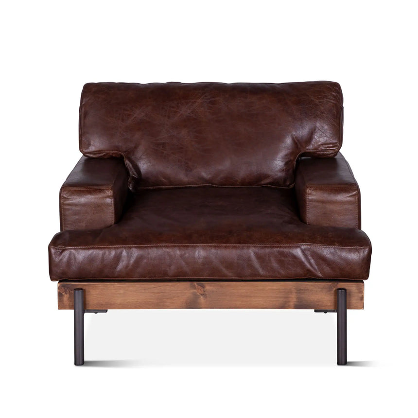 rustic brown leather armchair with wood frame and metal legs