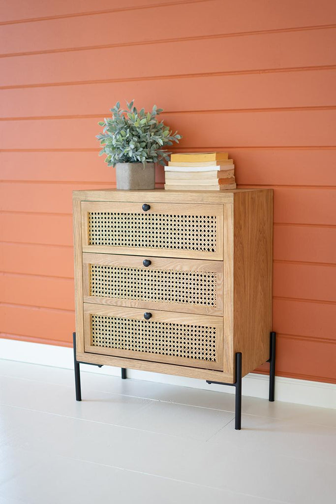 wood and woven cane nightstand on black metal legs with 3 drawers - front left view 2