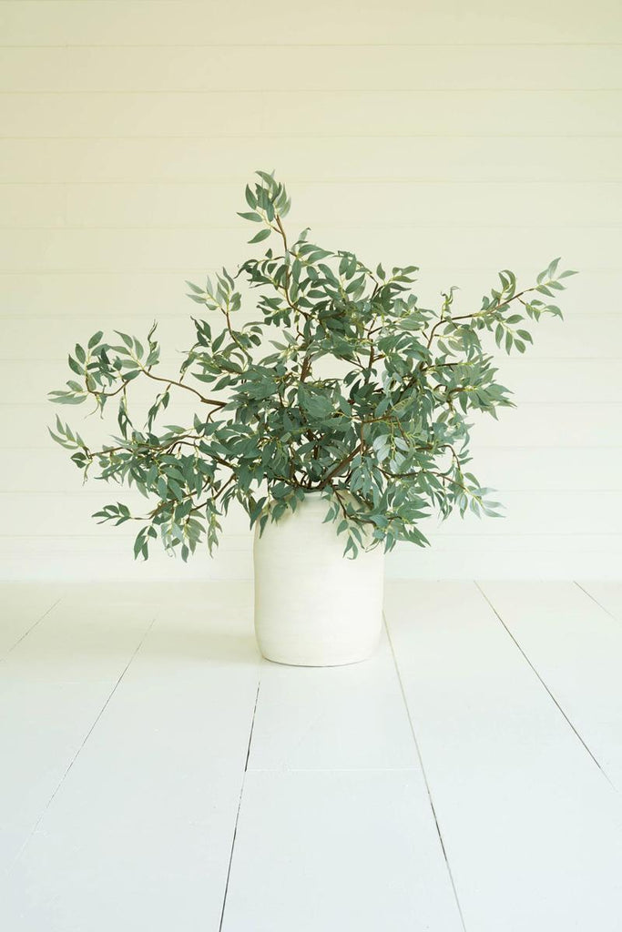 artificial plant with multiple branches and green leaves made with latex rubber - shown in white pot