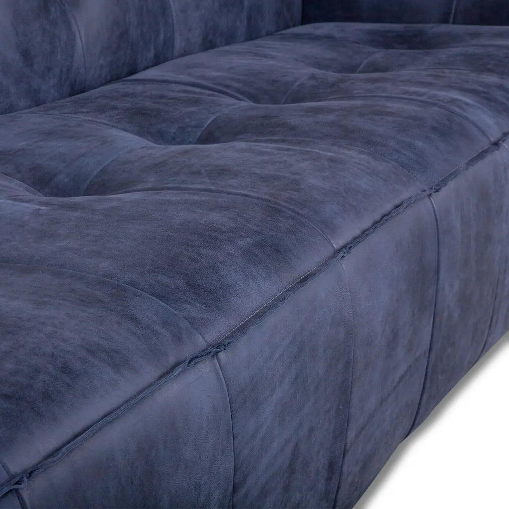 blue leather sofa - close-up of plush seating cushion