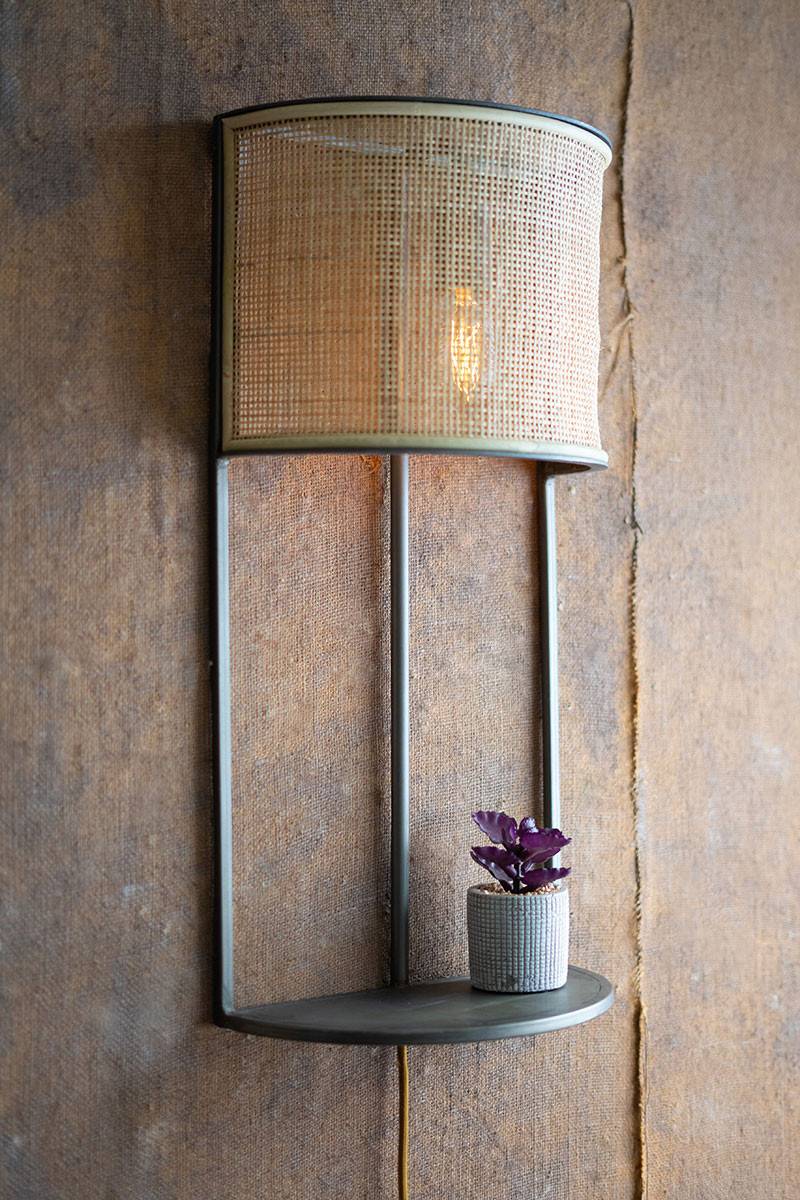 wall sconce with rattan shade and small shelf