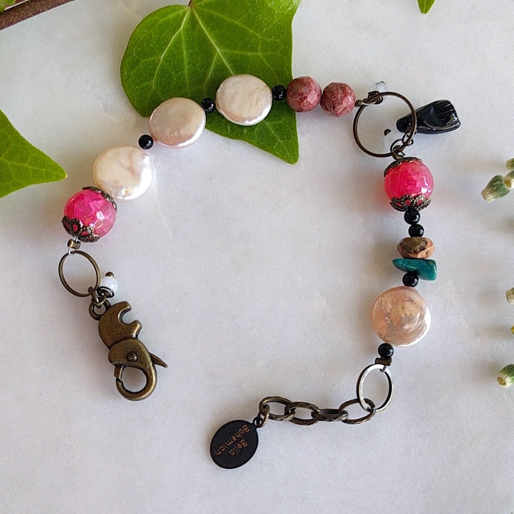 handmade bracelet with faceted pink agate, coin pearls, round black jasper, fancy brass caps, turquoise chips, and faceted brown jade