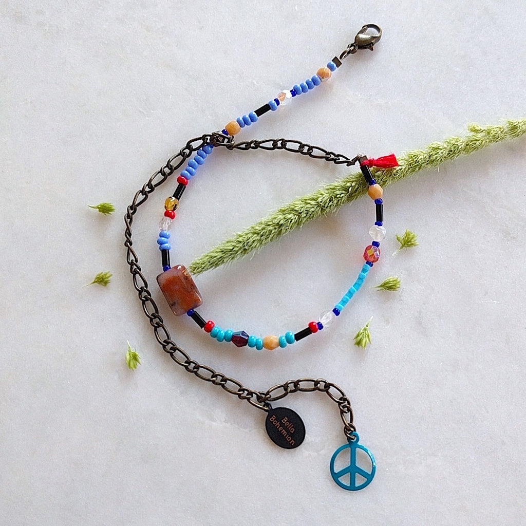 handmade friendship bracelets with colors of blue red amber and clear beads
