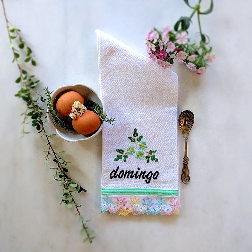 kitchen towel themed with rainbow pastel trim and day of the week: Domingo