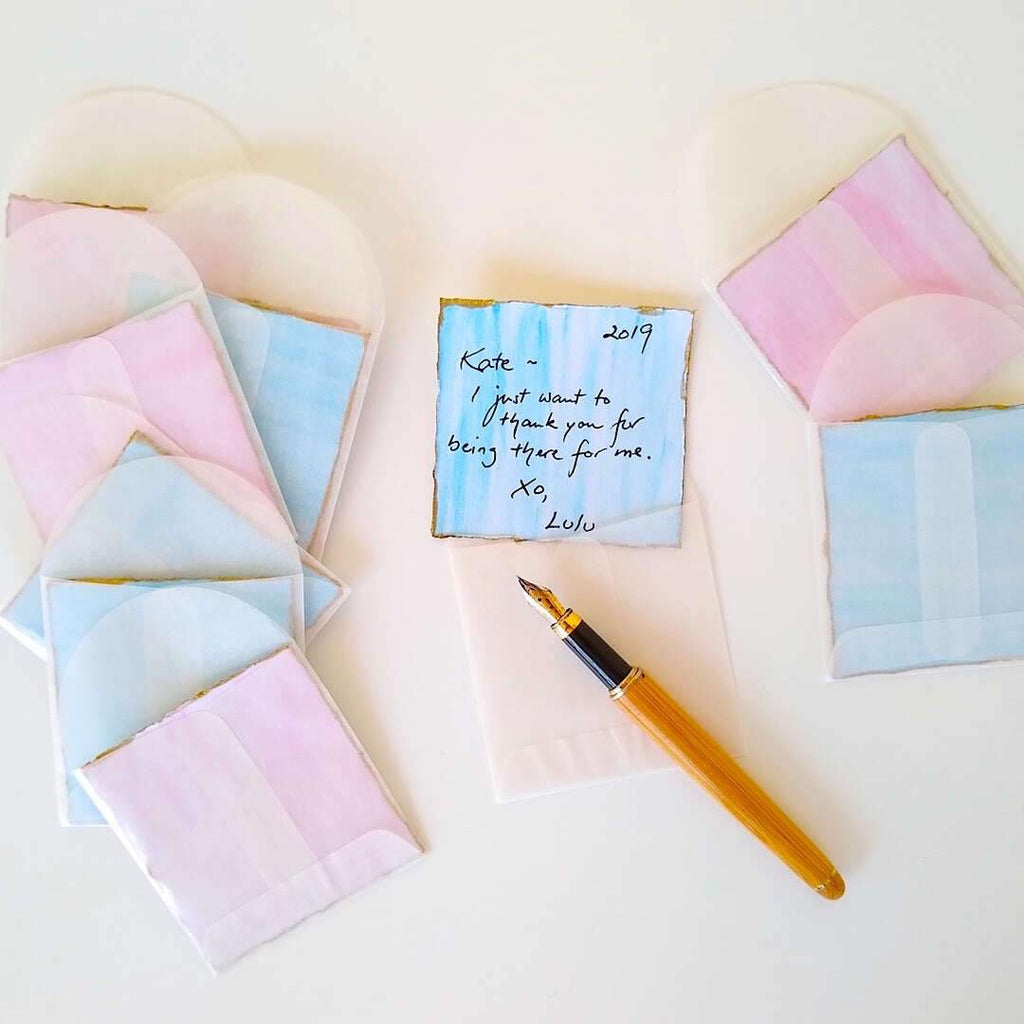 pink and blue watercolor hand painted gift cards with glassine envelopes