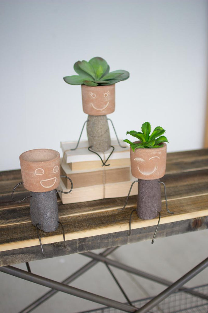clay and rock shelf sitting pots