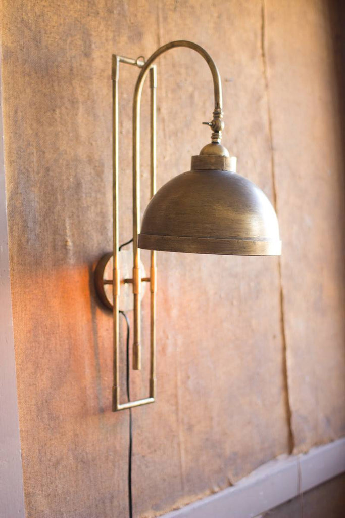 antique metal wall light with brass finish