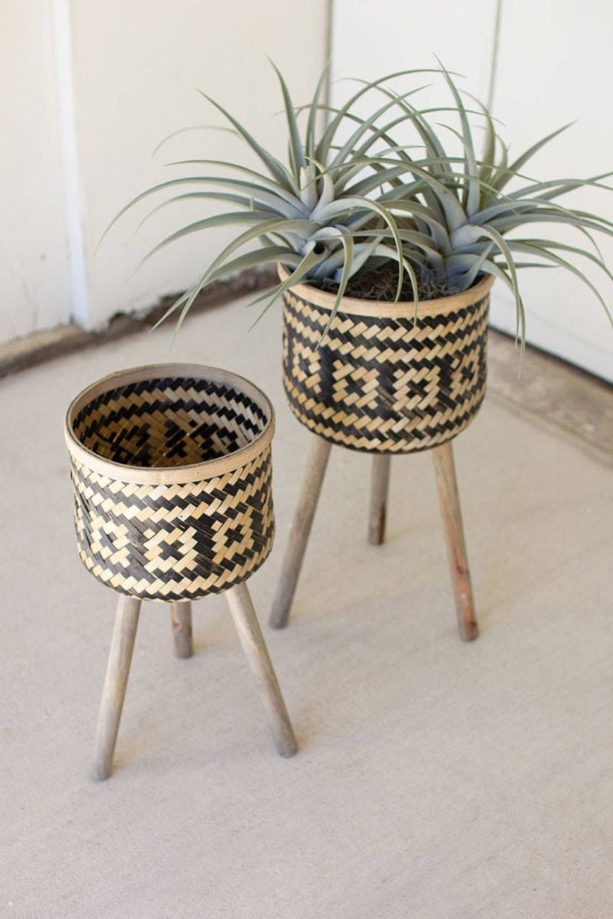 two woven bamboo plant stands with natural and black design