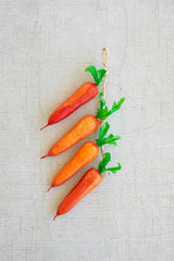 string of faux carrots - lined up