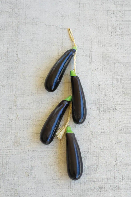 string of faux eggplants