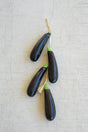 string of faux eggplants