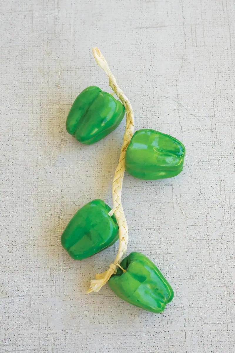 string of green faux bell peppers