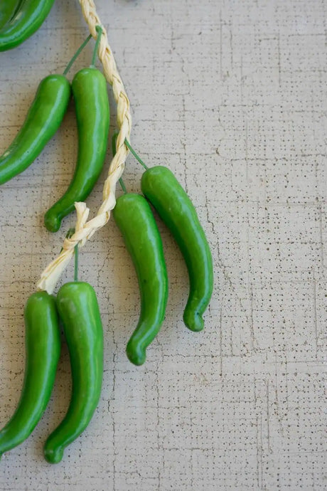 string of green faux peppers - close-up