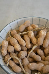 string of faux peanuts - shown in a bowl