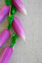 string of faux radishes - close-up on one faux radish