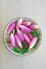 string of faux radishes - shown in a bowl