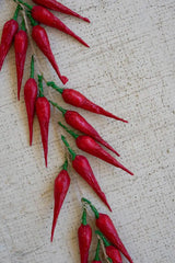 string of red faux peppers - close-up