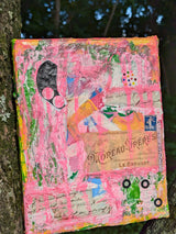 Colorful abstract pink heavy orginal art piece propped up on a tree