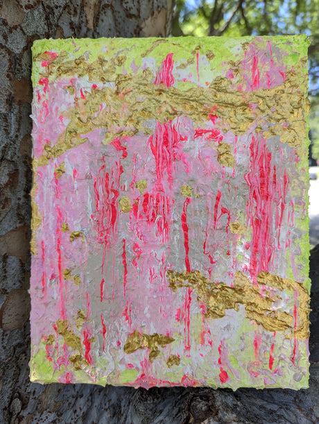 Original abstract art piece with pink and gold colors on a textured surface