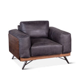 antique black leather armchair with plush upholstery - front angle view