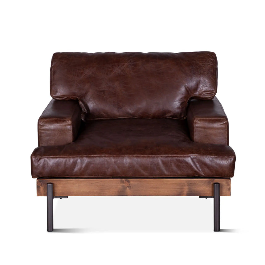 rustic brown leather armchair with wood frame and metal legs