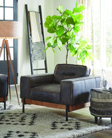 black leather armchair shown in studio living room