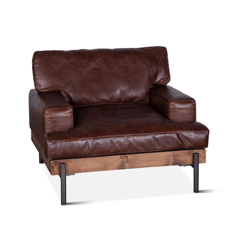 rustic brown leather armchair with wood frame and metal legs - angled front view