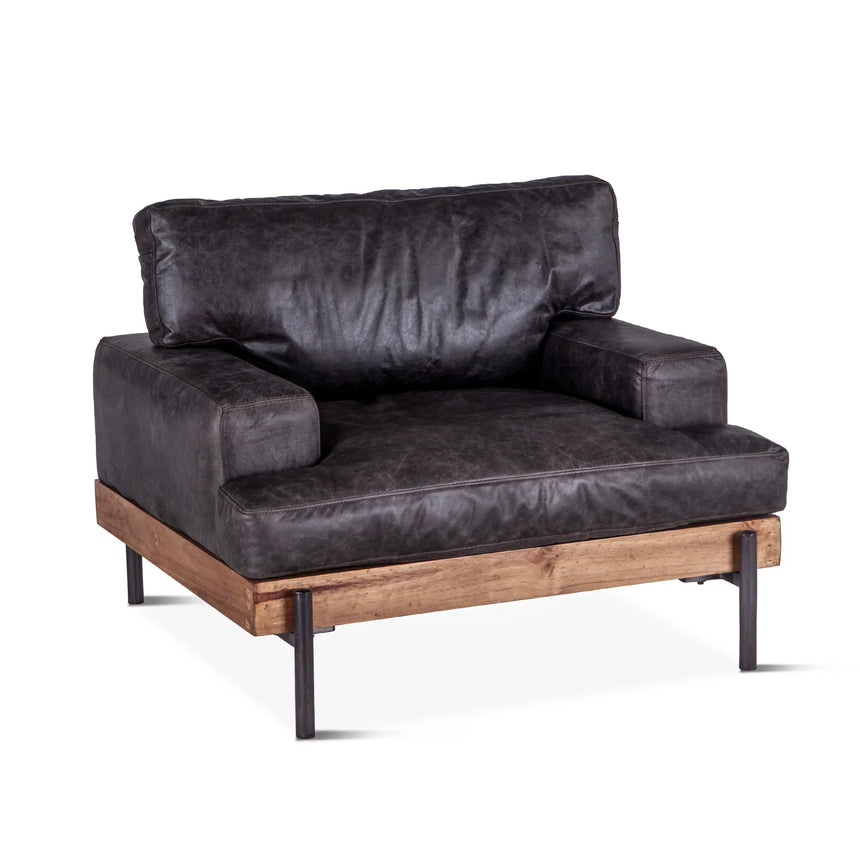 moroccan black leather armchair with wood frame and metal legs - angled front view