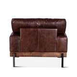 rustic brown leather armchair with wood frame and metal legs - rear view