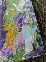 Original colorful abstract painting on a textured surface while zooming in on bottom right details
