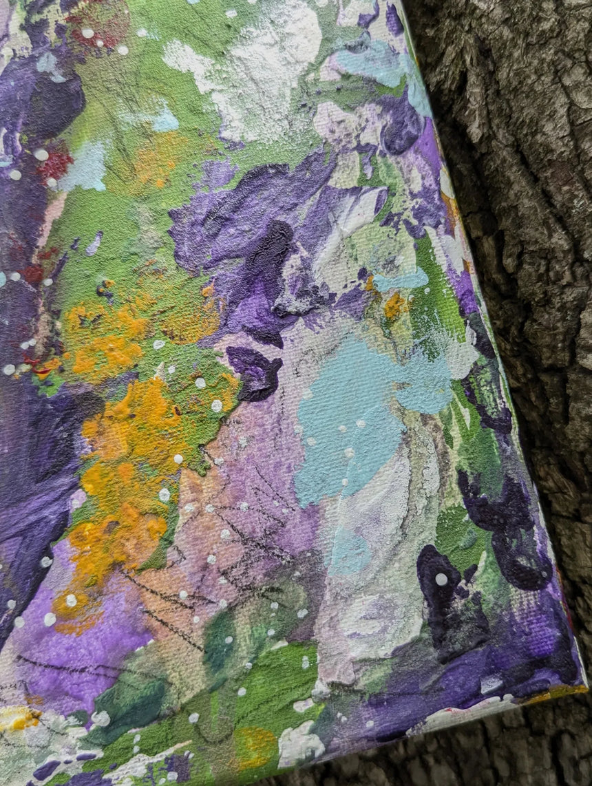 Original colorful abstract painting on a textured surface while zooming in on bottom right details
