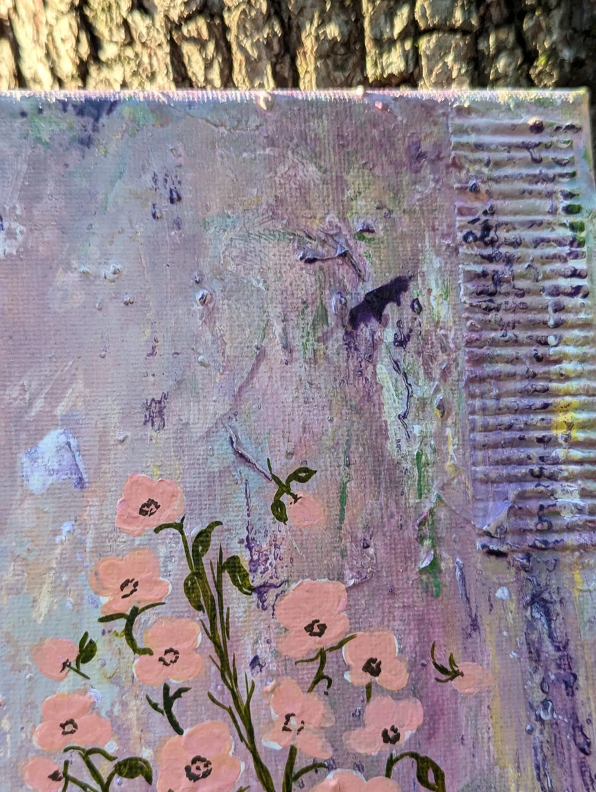 Close-up of top right of painting with focus on cardboard textured detail above light peach colored flowers with dark green stems and leaves.