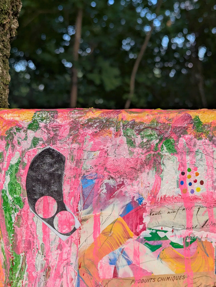 Collage art with pink and multicolor patterns on a textured surface - close-up of top canvas section
