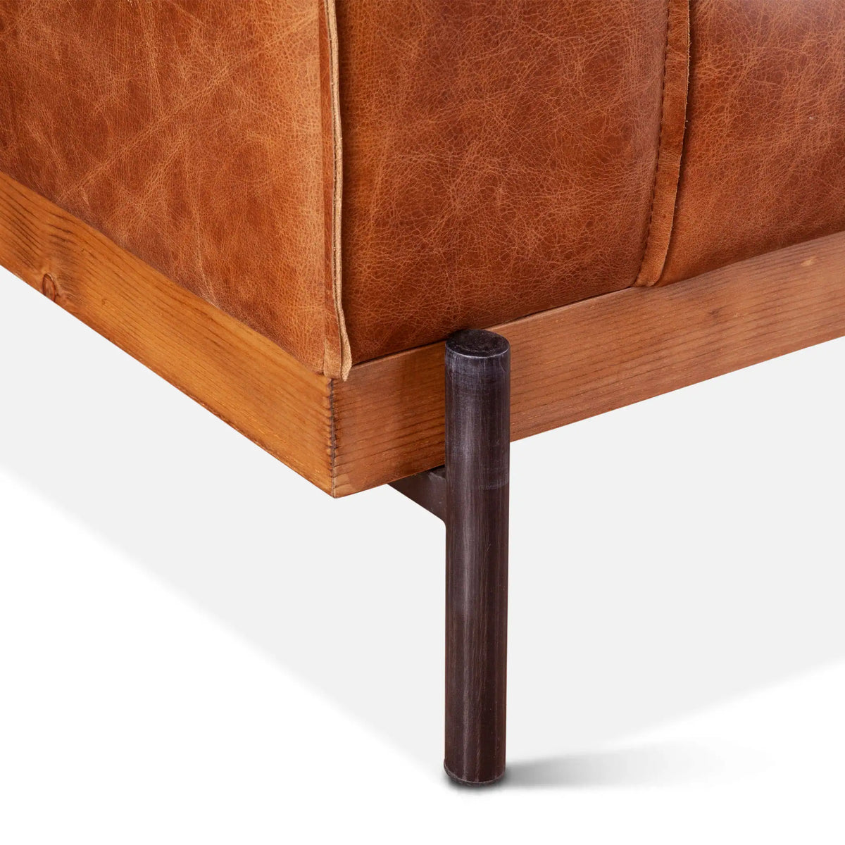 cognac color leather armchair - metal foot close-up