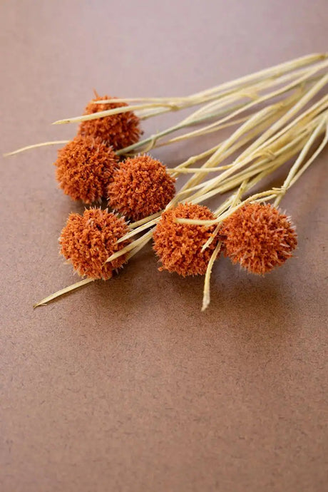 faux orange ball flowers - angled close-up