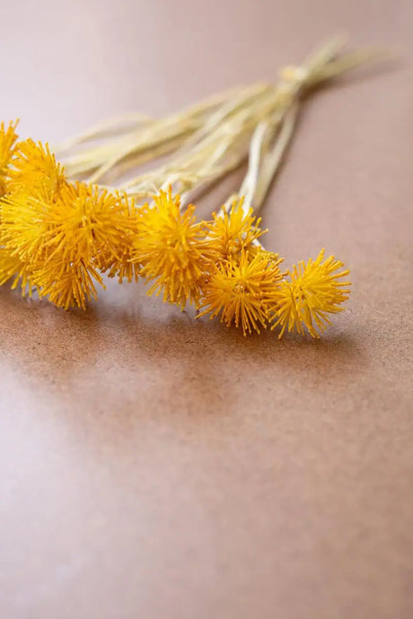 bundles of faux yellow mini flowers - close-up