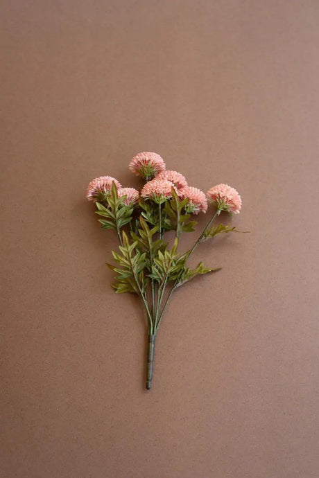 bundles of light pink faux zinnias