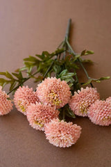 bundles of light pink faux zinnias - close-up