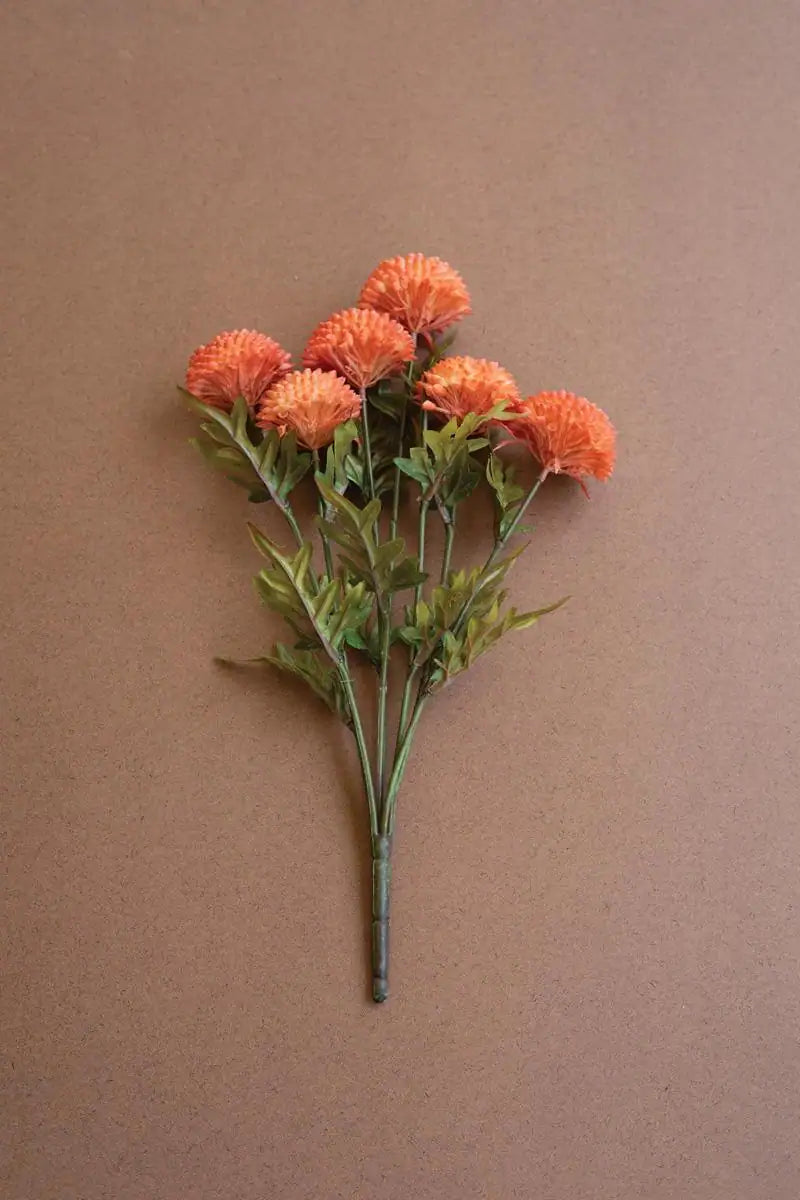 bundles of orange faux zinnias