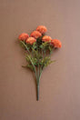 bundles of orange faux zinnias