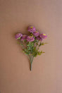 bundles of purple faux zinnias