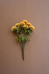 bundles of yellow faux zinnias