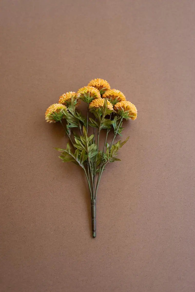 bundles of yellow faux zinnias