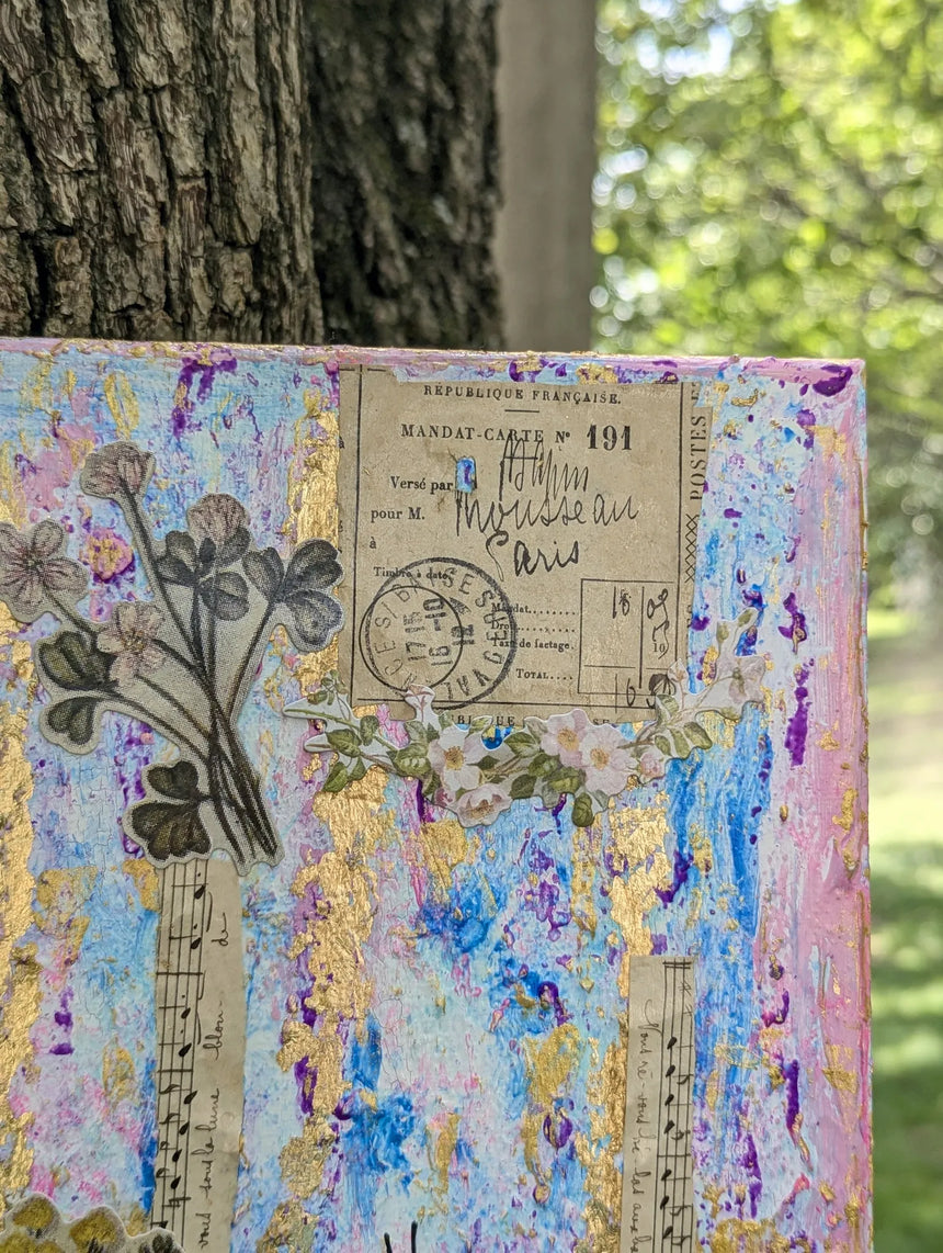 Close-up of Mandat-Carte vintage detail on top right corner of mixed media canvas collage