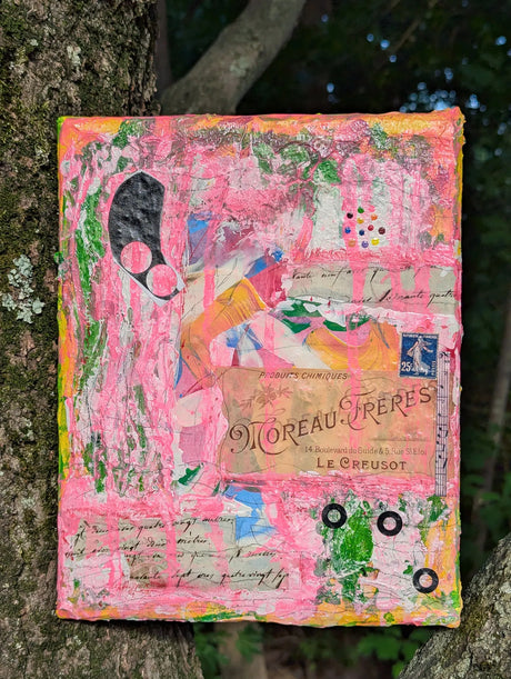 Colorful abstract mixed media painting by Rhônya Obst leaning against a tree