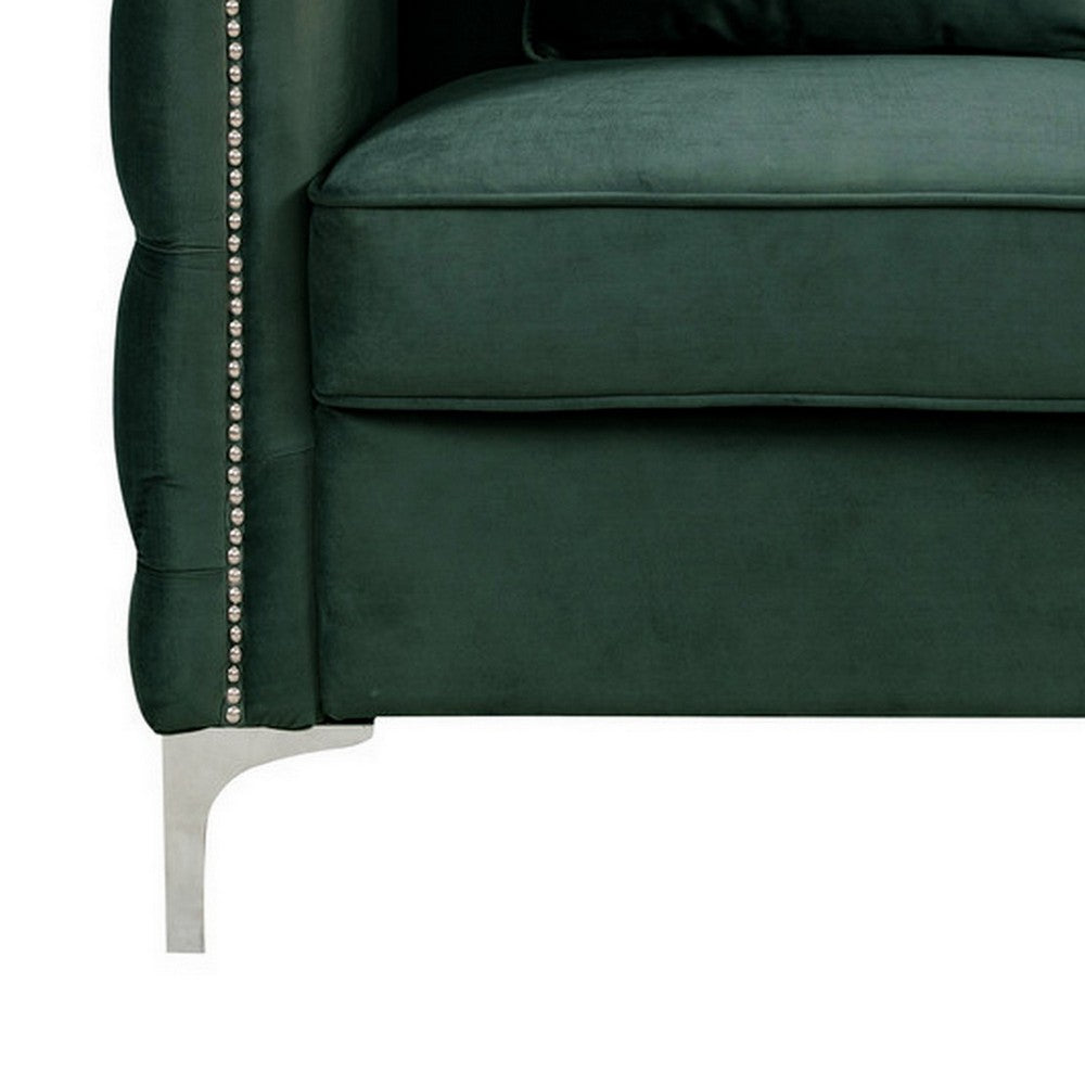 close-up of green sofa's metal foot and cushion