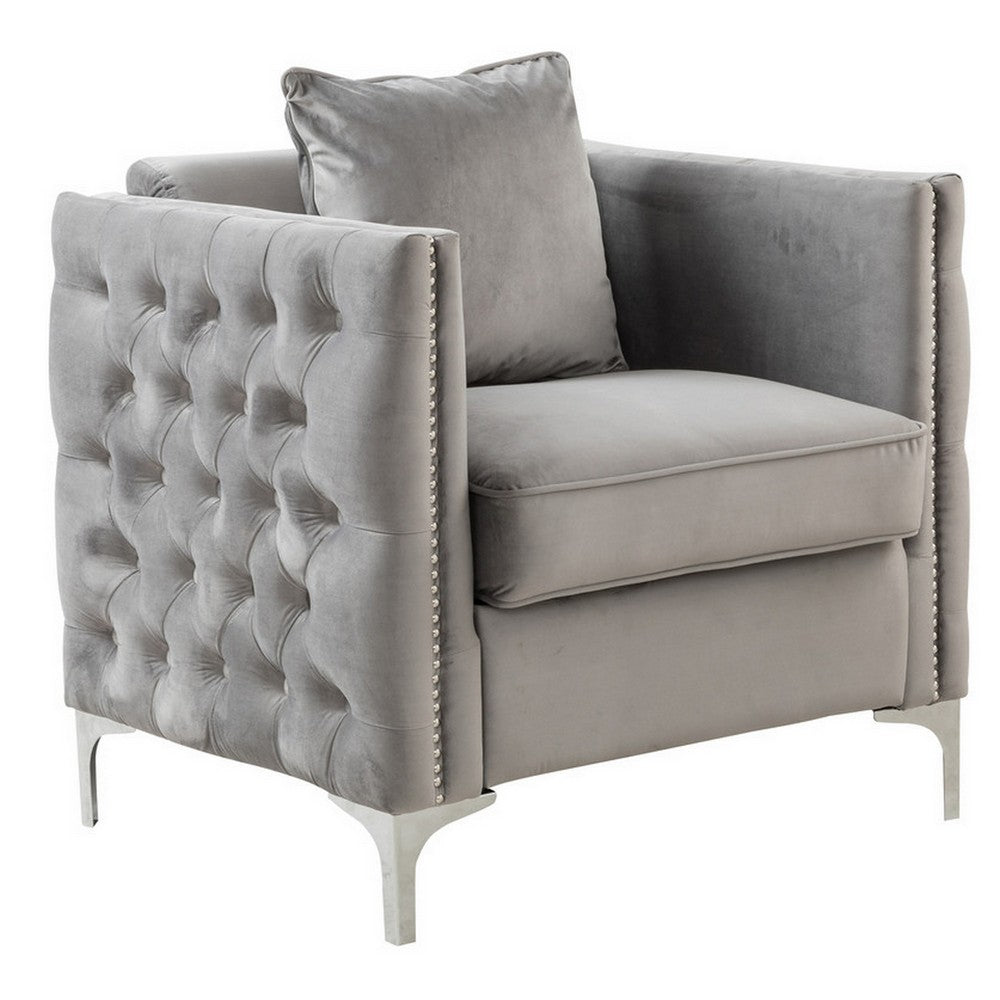 gray velvet sofa chair with loose pillow - front right view