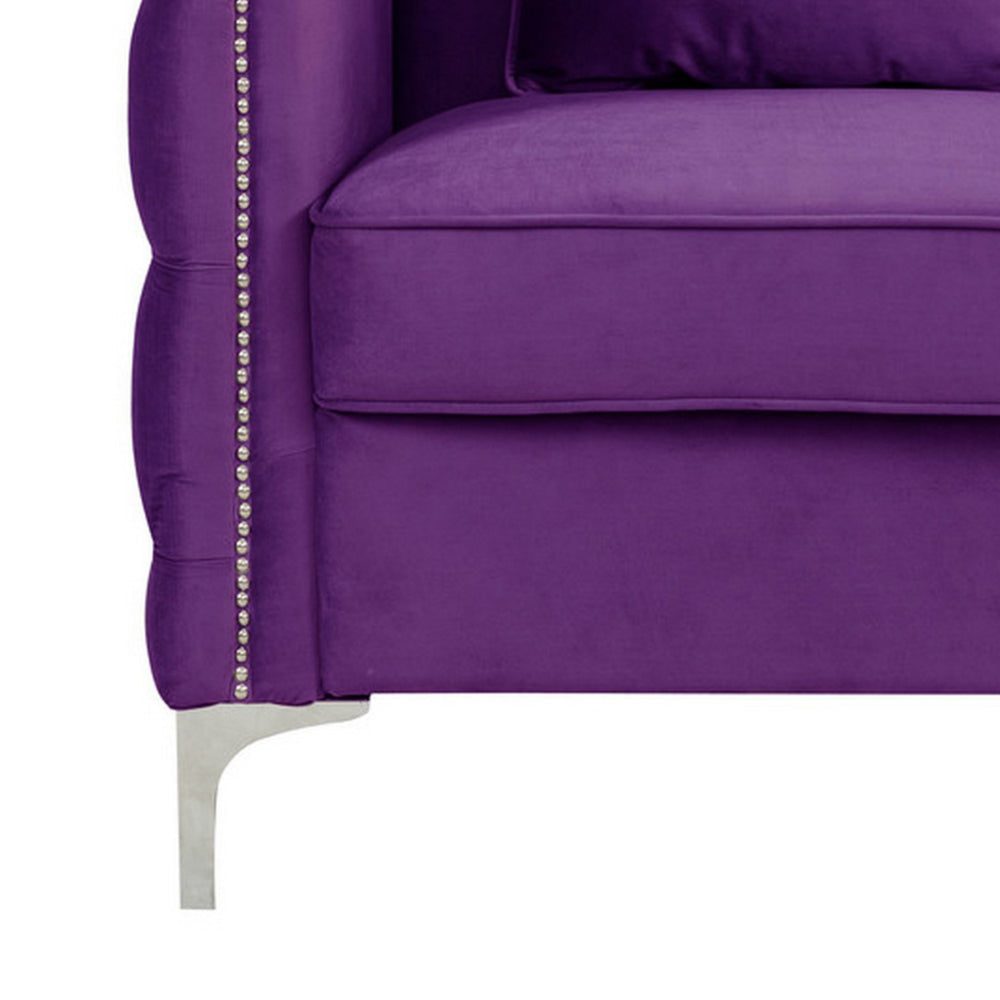 close-up of purple sofa's metal foot and cushion
