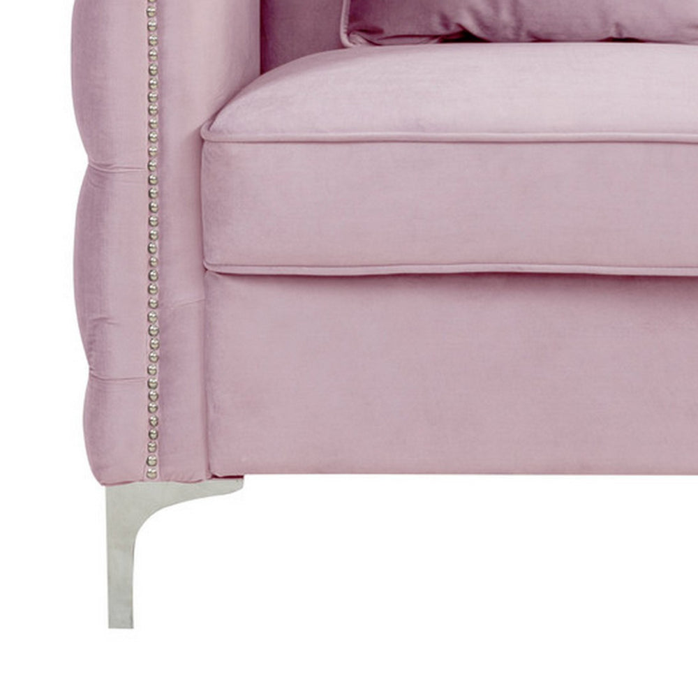 close-up of pink sofa's metal foot and cushion