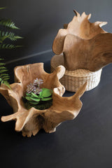 Wooden planters with natural textures on a dark surface